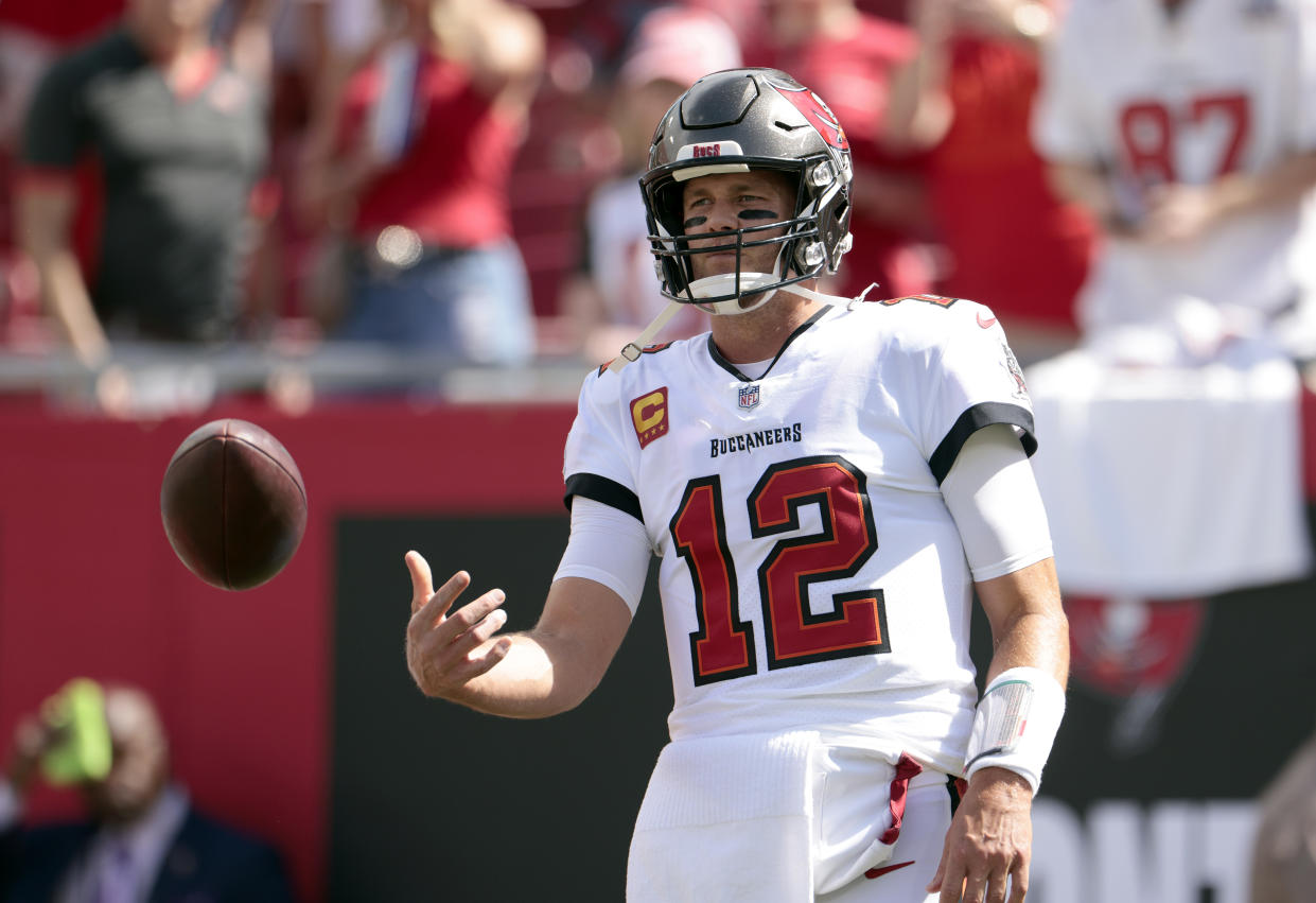 TAMPA, FLORIDA - SEPTEMBER 19: Quarterback Tom Brady #12 of the Tampa Bay Buccaneers warms up before the game against the Atlanta Falcons at Raymond James Stadium on September 19, 2021 in Tampa, Florida. (Photo by Douglas P. DeFelice/Getty Images)