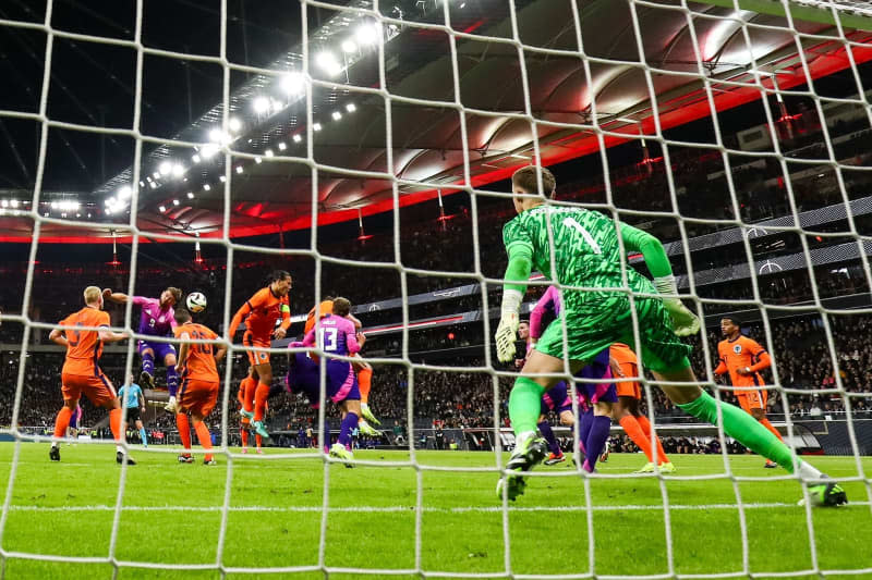 Germany's Niclas Fuellkrug (2nd L) scores his side's second goal of the game during the International Friendly soccer match between Germany and Netherlands at the Deutsche Bank Park stadium. Christian Charisius/dpa