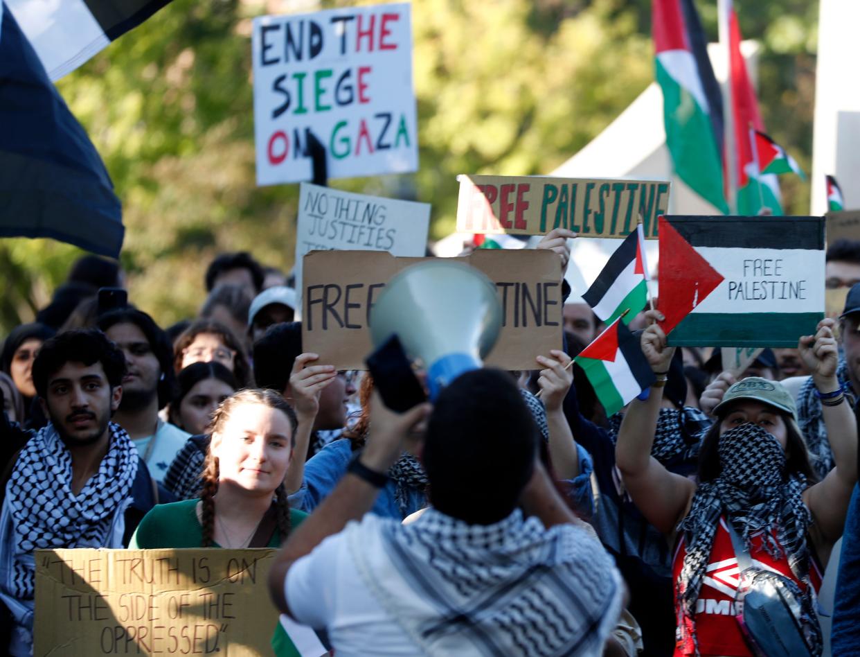 Protesters gather in response to the Palestine and Israel conflict, Thursday, Oct. 12, 2023, at Purdue University in West Lafayette, Ind.