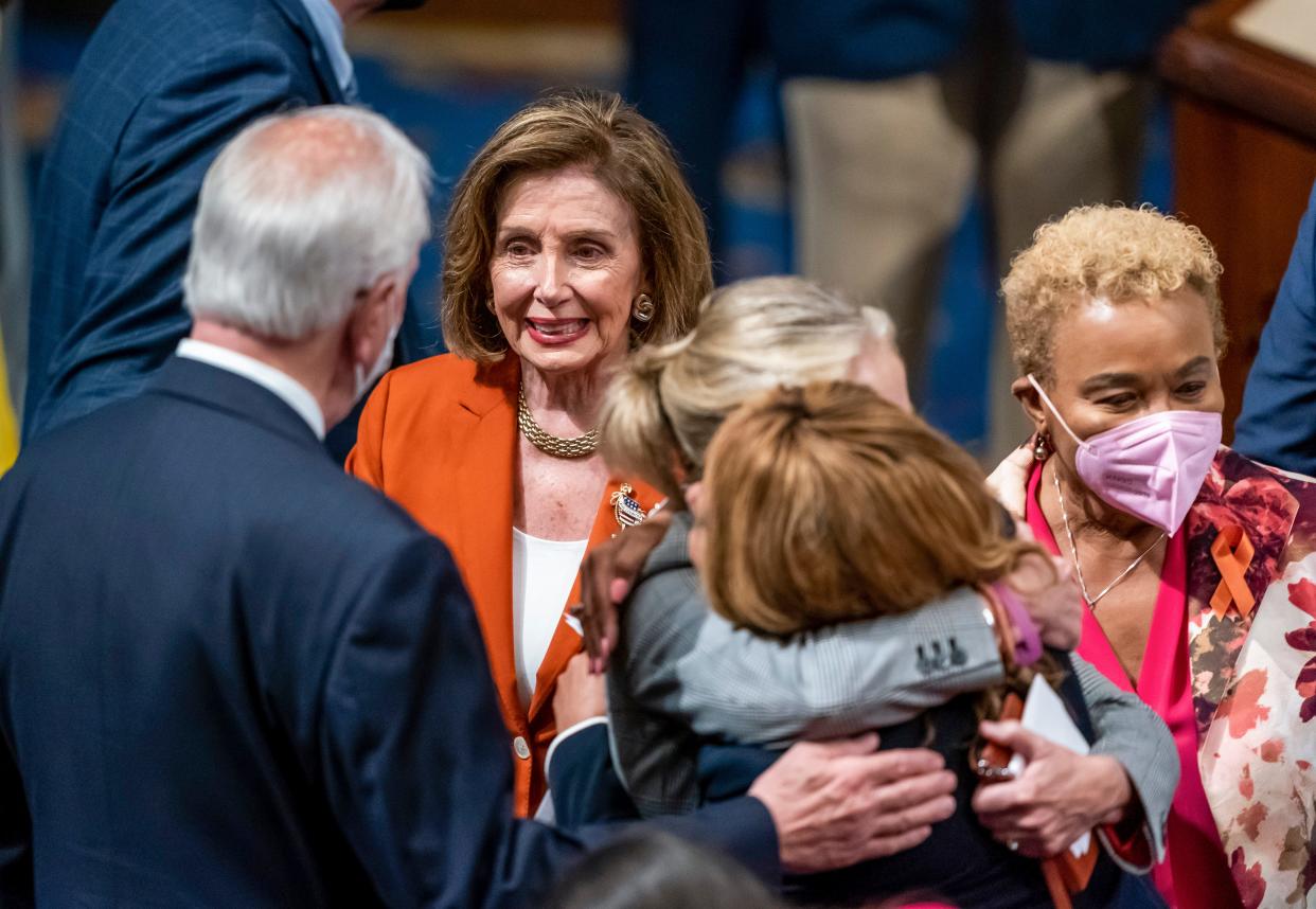Speaker of the House Nancy Pelosi, D-Calif., greets Rep. Mike Thompson, D-Calif., chairman of the House Gun Violence Prevention Task Force, left, as Rep. Madeleine Dean, D-Penn., hugs Rep. Lucy McBath, D-Ga., with Rep. Barbara Lee, D-Calif., right, after passage of the gun safety bill in the House, at the Capitol in Washington, Friday, June 24, 2022. (AP Photo/J. Scott Applewhite) ORG XMIT: DCSA128