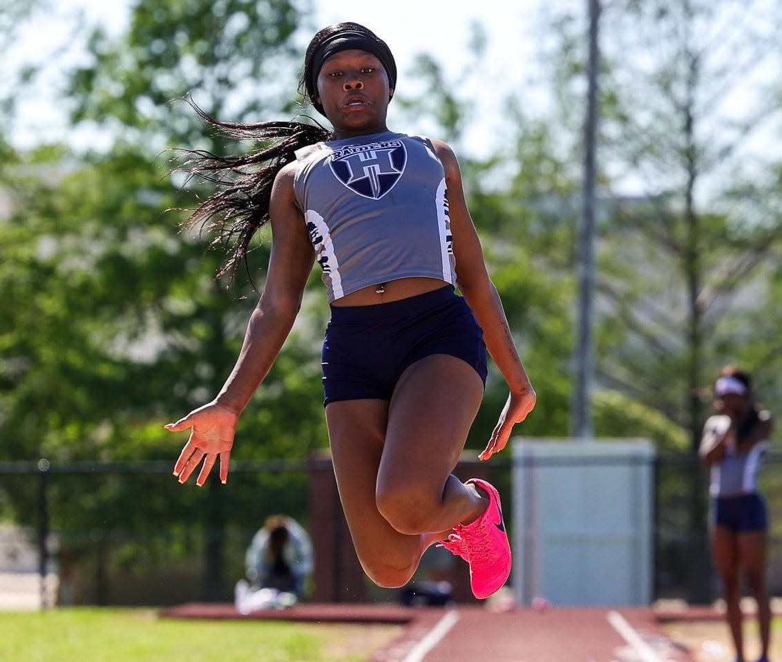 Huntington's Demetria Harris competes in the long jump at the 2024 Caddo Parish meet.