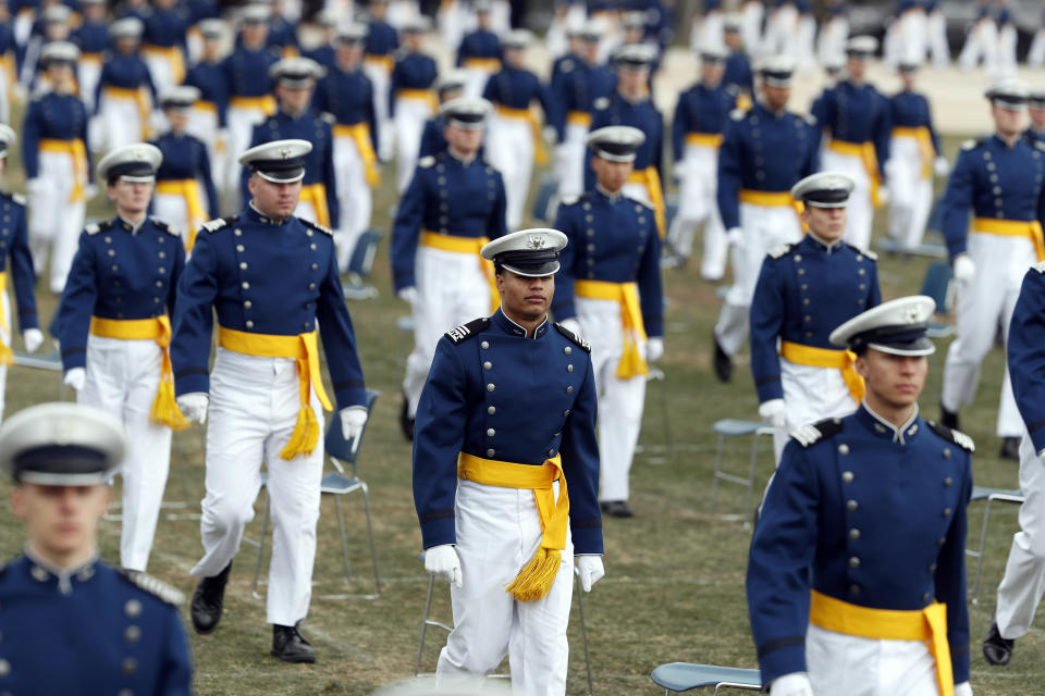 FILE - In this April 18, 2020 file photo, cadets practice social distancing as they march to their seats to start the graduation ceremony for the class of 2020 at the U.S. Air Force Academy, at Air Force Academy, Colo. Minority students are significantly underrepresented when it comes to getting nominations from members of Congress to attend the nation's military service academies, according to an analysis released Wednesday, March 17, 2021. (AP Photo/David Zalubowski, File)