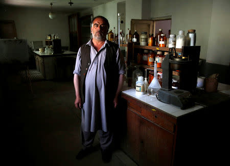 Khuda Daad, head of the laboratory of the Jabal Saraj cement factory, poses for a photograph at his lab in Jabal Saraj, north of Kabul, Afghanistan May 8, 2016. REUTERS/Ahmad Masood
