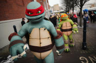 Life size Teenage Mutant Ninja Turtles cartoon characters are led outside for a photocall during the 2013 London Toy Fair at Olympia Exhibition Centre on January 22, 2013 in London, England. (Photo by Dan Kitwood/Getty Images)