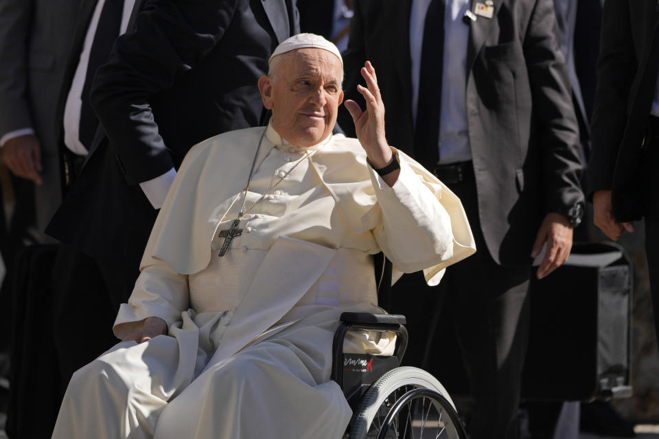 Pope Francis waves on arrival to meet with representatives of charity centers at the Centro Paroquial de Serafina in Lisbon, Friday, Aug. 4, 2023. Pope Francis is on the third day of a five-day pastoral visit to Portugal that includes the participation at the 37th World Youth Day, and a pilgrimage to the holy shrine of Fatima. (AP Photo/Armando Franca)