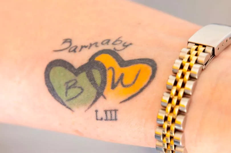 The tattoo on Emma's wrist