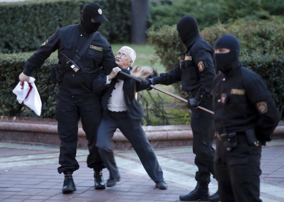 FILE - In this Wednesday, Aug. 26, 2020 file photo, Opposition activist Nina Baginskaya, 73, center, struggles with police during a Belarusian opposition supporters rally at Independence Square in Minsk, Belarus. President Alexander Lukashenko earned the nickname of “Europe’s last dictator” in the West for his relentless repression of dissent since taking the helm in 1994. was once called “Europe’s last dictator” in the West and has ruled Belarus with an iron fist for 27 years. But when massive protests that began last August presented him with an unprecedented challenge, he responded with exceptional force. (AP Photo/Dmitri Lovetsky, File)