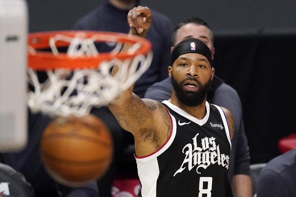 Los Angeles Clippers forward Marcus Morris Sr. watches his shot go through during the first half of an NBA basketball game against the Philadelphia 76ers Saturday, March 27, 2021, in Los Angeles. (AP Photo/Mark J. Terrill)