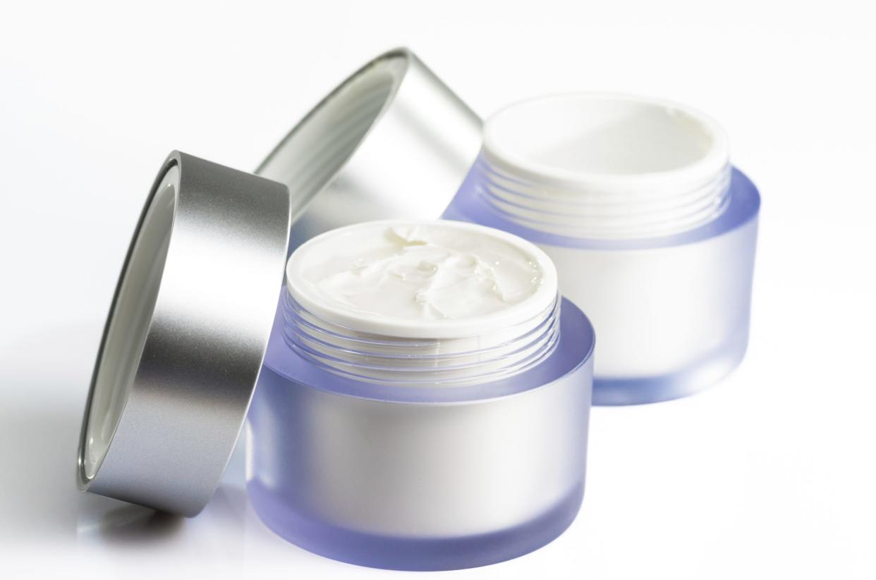 Stock photo of generic jars of facial creams.