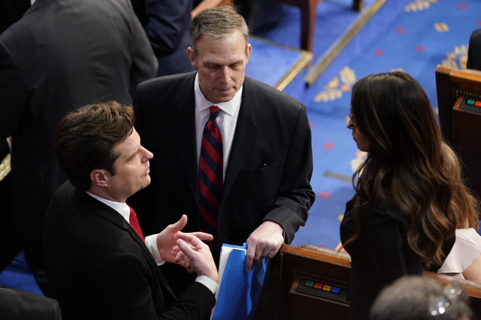 Rep. Matt Gaetz, R-Fla., left, talks with Rep. Scott Perry, R-Pa., and Rep. Lauren Boebert, R-Colo., after the first round of voting for House Speaker during opening day of the 118th Congress at the U.S. Capitol, Tuesday, Jan 3, 2023, in Washington. (AP Photo/Andrew Harnik)