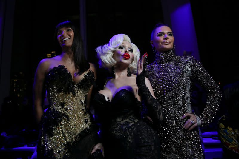 Center, Amanda Lepore poses with guests in the front row before the Blonds Fall 2020 show during New York Fashion Week