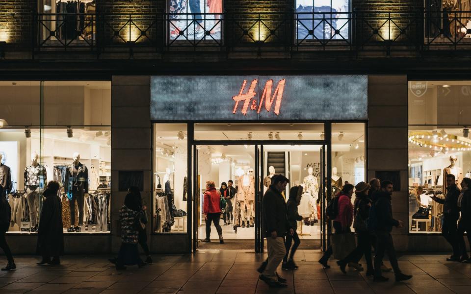 People walking in front of H&M store on Oxford Street - Alena Kravchenko