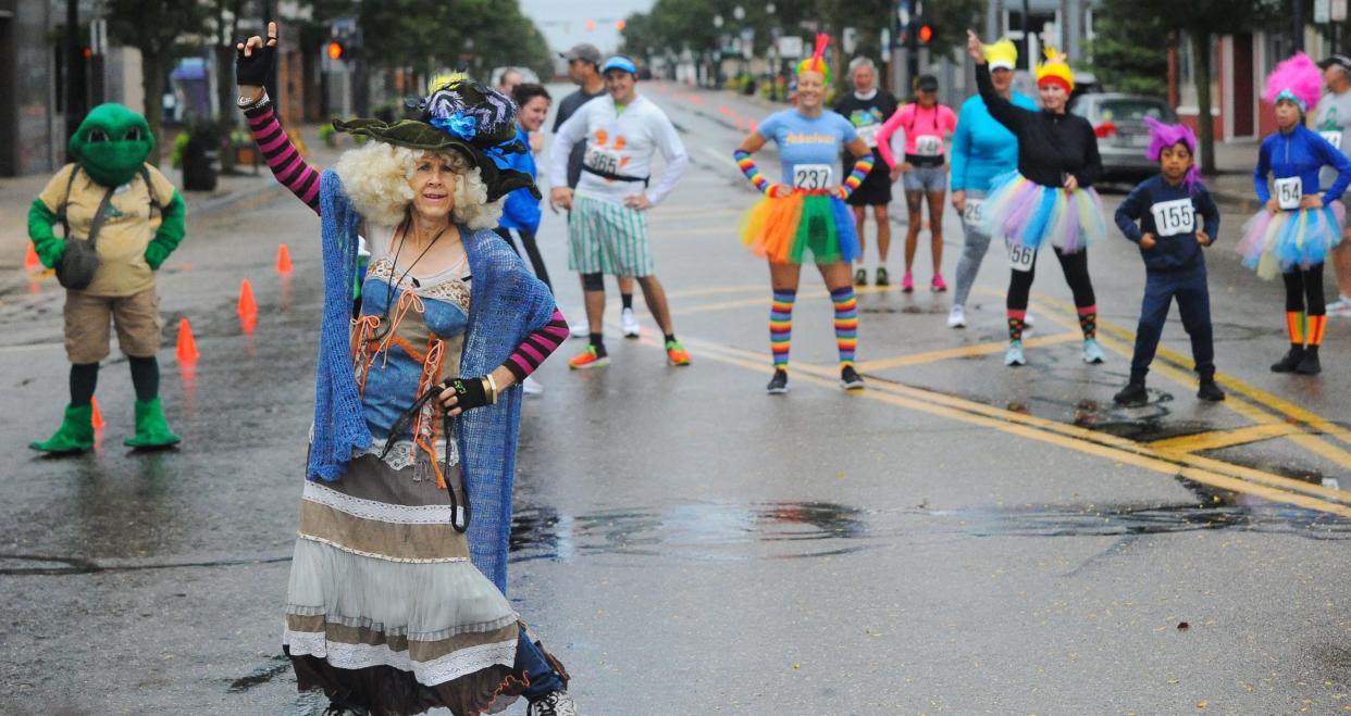 Sherry Groom, as Sigrid the Troll Queen, leads a group in a TikTok dance challenge Sunday, Sept. 25, 2022, on East Main Street in Alliance.