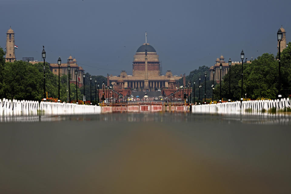 Rajpath, India's ceremonial boulevard is deserted, as India's Presidential Palace is seen during a lockdown amid concerns over the spread of Coronavirus, in New Delhi, India, April 27, 2020. (AP Photo/Altaf Qadri)