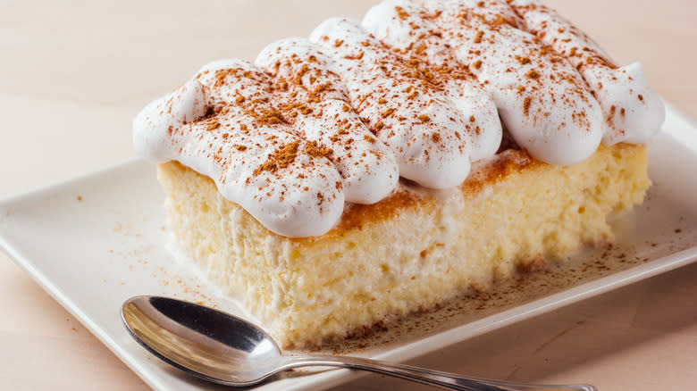 Slice of tres leches cake on a tray
