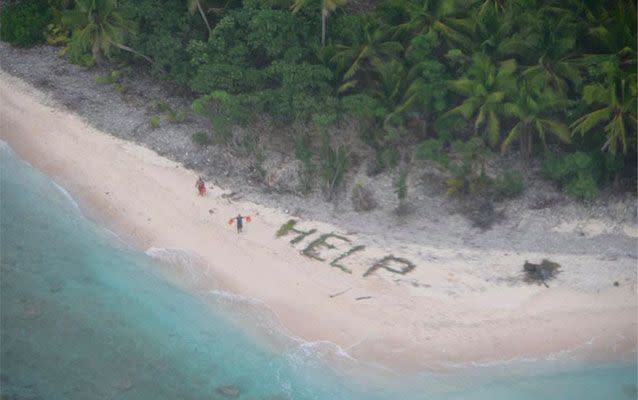 Three men stranded on a remote island were rescued after spelling out 'HELP' with palms. Pictures: US Coast Guard Hawaii Pacific