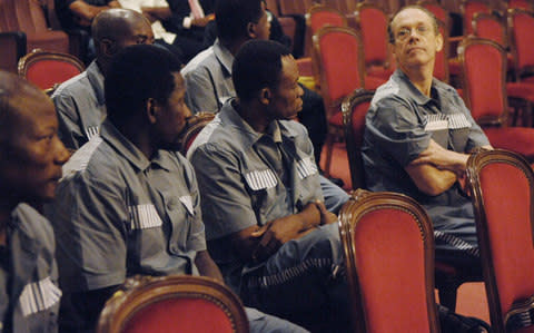 Mann (right) with some of his fellow defendants, during their 2008 trial in Equatorial Guinea for plotting to overthrow President Obiang - Credit: AP