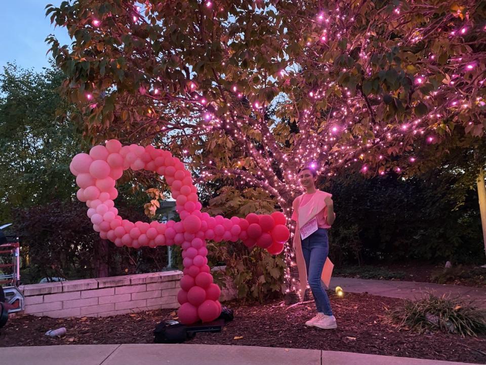 Mariam Abdelhaq, Pink Light Honorary Chair for the Pink Light Walk, lights up a tree representing "the strength, the courage, the fight and the support of the village that is surrounds us tonight" at the Dale and Frances Hughes Cancer Center. The Pink Light Walk drew hundreds of people in support of breast cancer awareness to East Stroudsburg on Oct. 6, 2022.