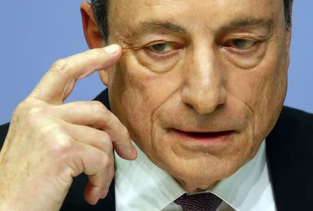 FILE PHOTO - European Central Bank (ECB) President Mario Draghi holds a news conference at the ECB headquarters in Frankfurt, Germany, March 7, 2018. REUTERS/Ralph Orlowski