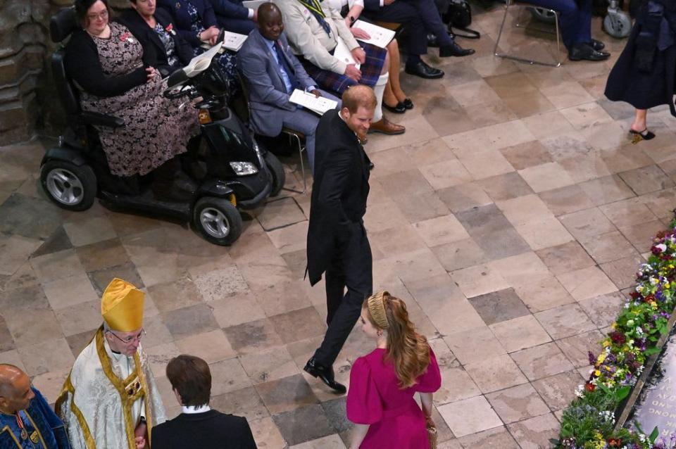 Prince Harry smiles back at Princess Beatrice