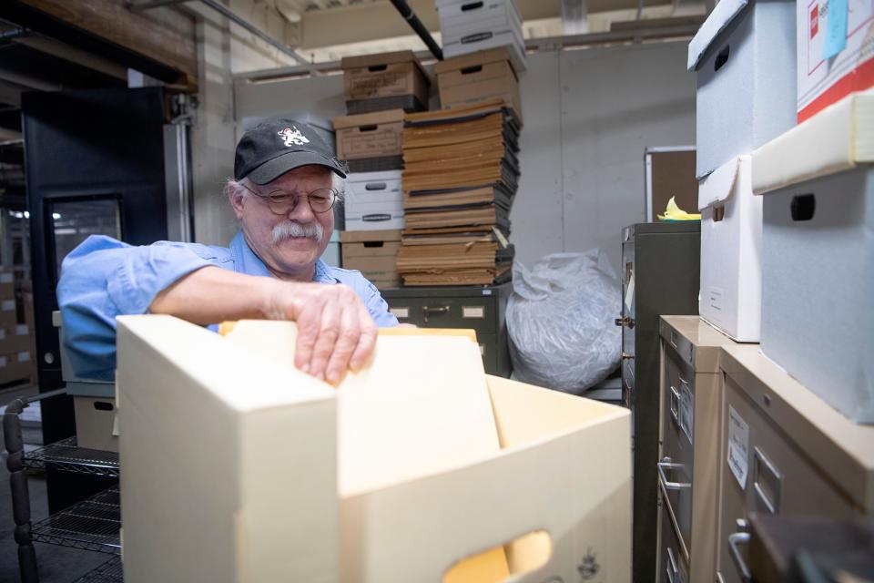 Gene Hyde boxes photographs from the Asheville Citizen Times, January 29, 2024.