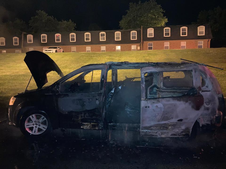 Monroe Fire Protection District firefighters found a fully engulfed minivan at Woodland Springs Apartments on July 4, 2022.