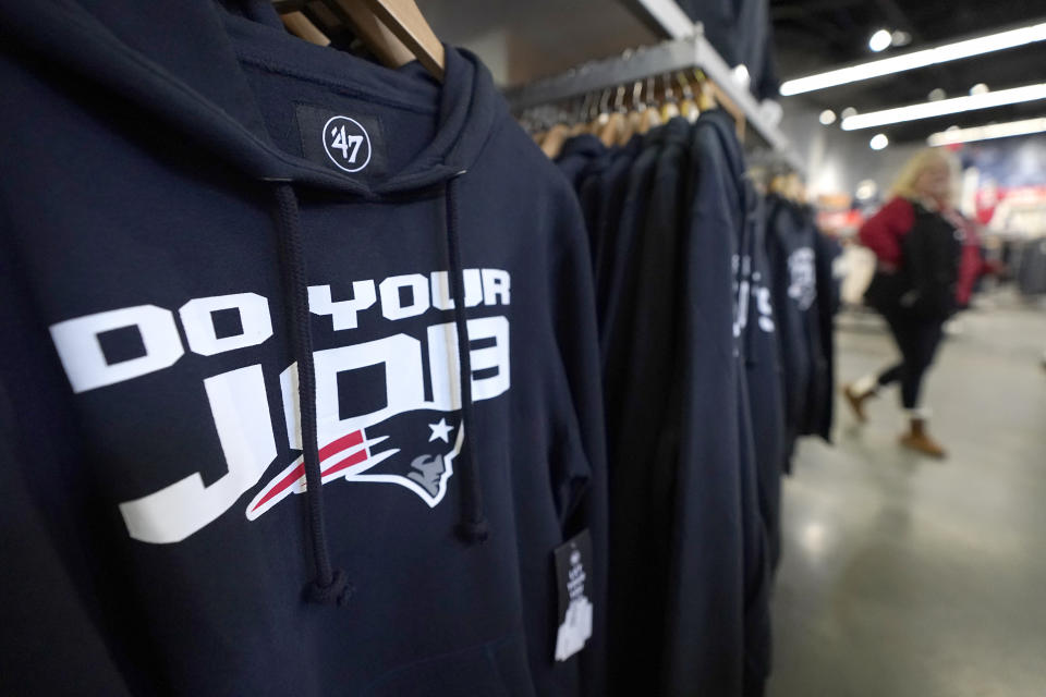 A sweatshirt, left, with a phrase frequently attributed to New England Patriots head coach Bill Belichick, hangs on a rack, Thursday, Jan. 11, 2024, at the Patriots ProShop in Foxborough, Mass. Six-time NFL champion Bill Belichick has agreed to part ways as the coach of the New England Patriots on Thursday, bringing an end to his 24-year tenure as the architect of the most decorated dynasty of the league's Super Bowl era, a source told the Associated Press on the condition of anonymity because it has not yet been announced. (AP Photo/Steven Senne)