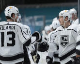 Los Angeles Kings right wing Dustin Brown, right, is congratulated by center Gabriel Vilardi (13) after scoring a goal against the San Jose Sharks during the second period of an NHL hockey game Saturday, April 10, 2021, in San Jose, Calif. (AP Photo/Tony Avelar)