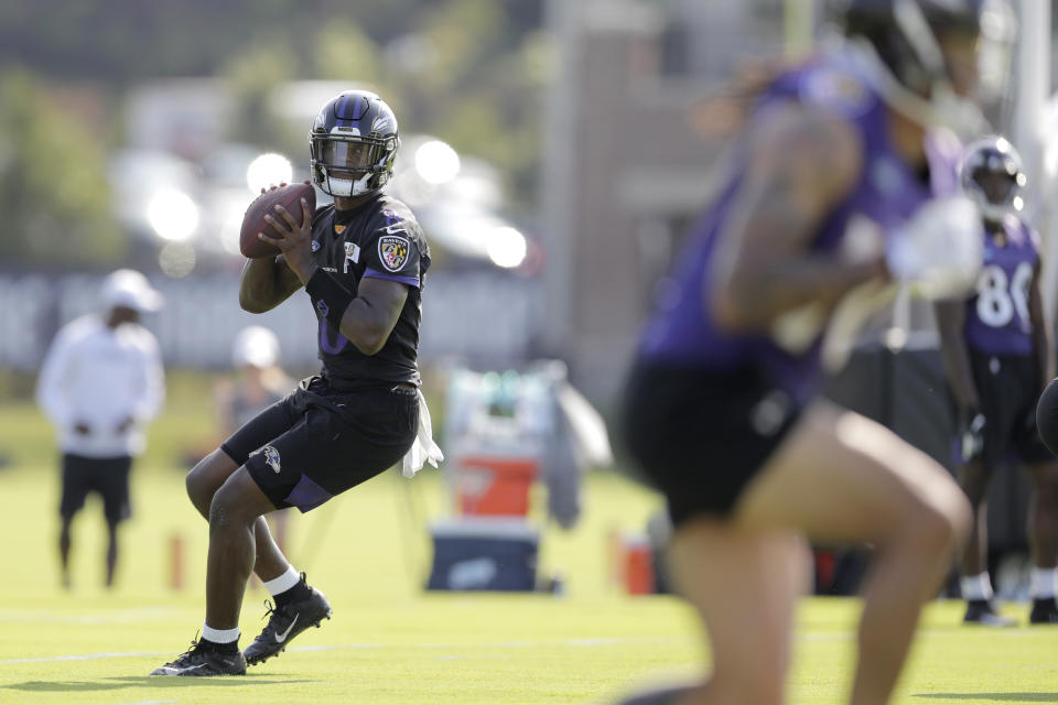 Baltimore Ravens quarterback Lamar Jackson works out during NFL football training camp, Thursday, July 25, 2019, in Owings Mills, Md. (AP Photo/Julio Cortez)