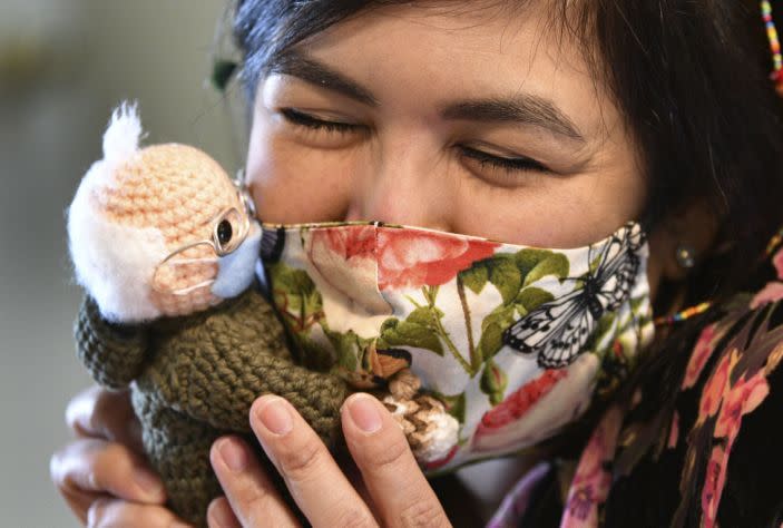 Tobey King, of Corpus Christi, embraces the crochet Bernie Sanders doll that she made and sold on eBay for $20,300 on Tuesday, Jan. 26, 2021. All of the proceeds are being donated to Meals on Wheels.