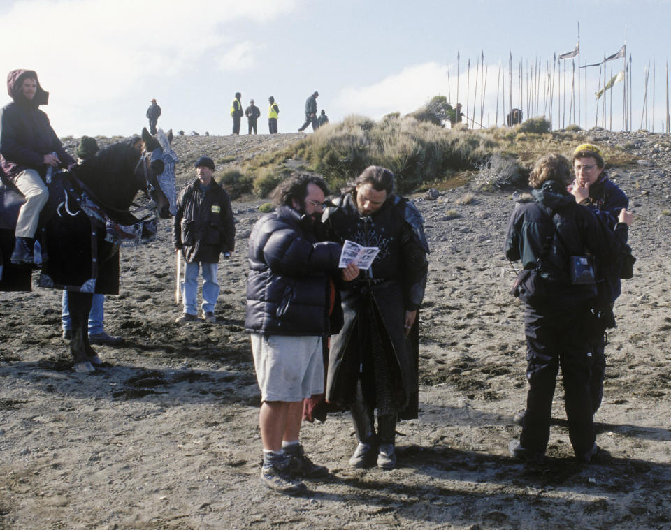 Peter Jackson (centre, in shorts) giving direction to Viggo Mortensen (Aragorn) on the set of 2003's Oscar-winning The Lord of the Rings: The Return of the King. (New Line/Alamy)