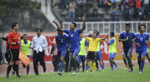 Nepalese forward Bharat Khawas (C) celebrates with teammates after scoring a goal against Jordan during their 2014 World Cup Asian zone qualifying football match in Kathmandu. After suffering a 9-0 hiding in the first leg, Nepal retrieved a modicum of pride, holding Jordan to a 1-1 draw in Kathmandu thanks to an 80th-minute equaliser from Khawas