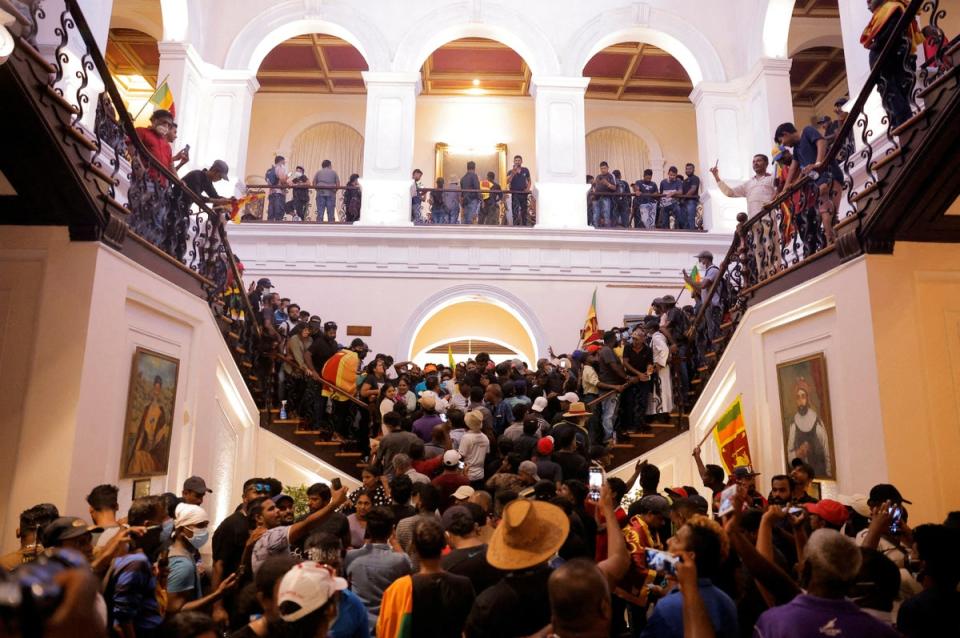 Demonstrators protest inside the President’s House, after President Gotabaya Rajapaksa fled, amid the country’s economic crisis, in Colombo, Sri Lanka (Reuters)