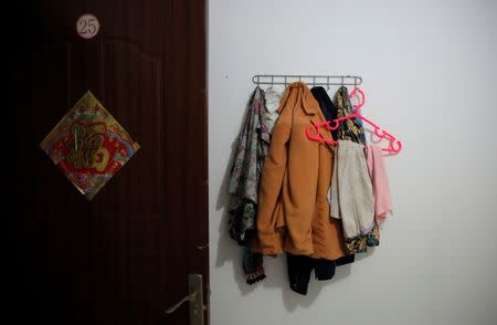 Clothes hang in a room where Huang and her husband Pan stay at the accommodation where some patients and their family members stay while seeking medical treatments in Beijing, China, June 22, 2016. REUTERS/Kim Kyung-Hoon