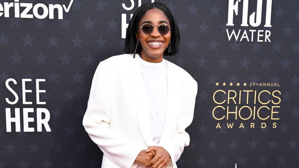 “The Bear” actress Ayo Edebiri arrived in an all-white suit, by the Olsen twins' label The Row, and Oliver Peoples sunglasses. - Gilbert Flores/Variety/Getty Images