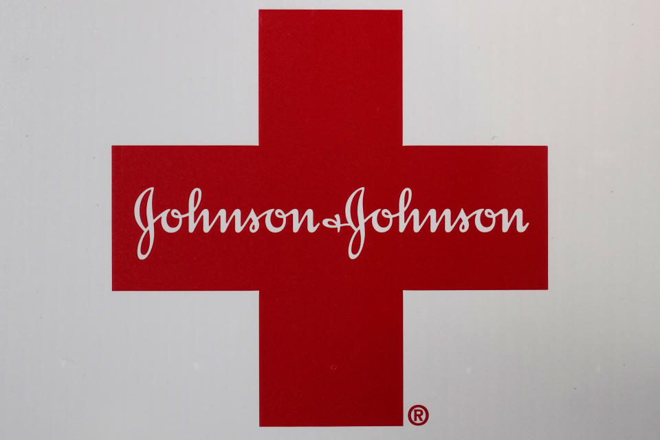 FILE - The Johnson & Johnson logo appears on the exterior of a first aid kit in Walpole, Mass., on Feb. 24, 2021. Idaho officials on Friday, May 13, 2022, agreed to a $119 million settlement with drugmaker Johnson & Johnson and three major distributors over their role in the opioid addiction crisis. (AP Photo/Steven Senne, File)
