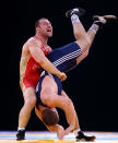Aslanbek Khushtov of Russia lifts Vilius Laurinatis of Lithuania upside down in a 96k Men's Greco-Roman bout during the Wrestling LOCOG Test Event for London 2012 at ExCel on December 10, 2011 in London, England. (Photo by Julian Finney/Getty Images)