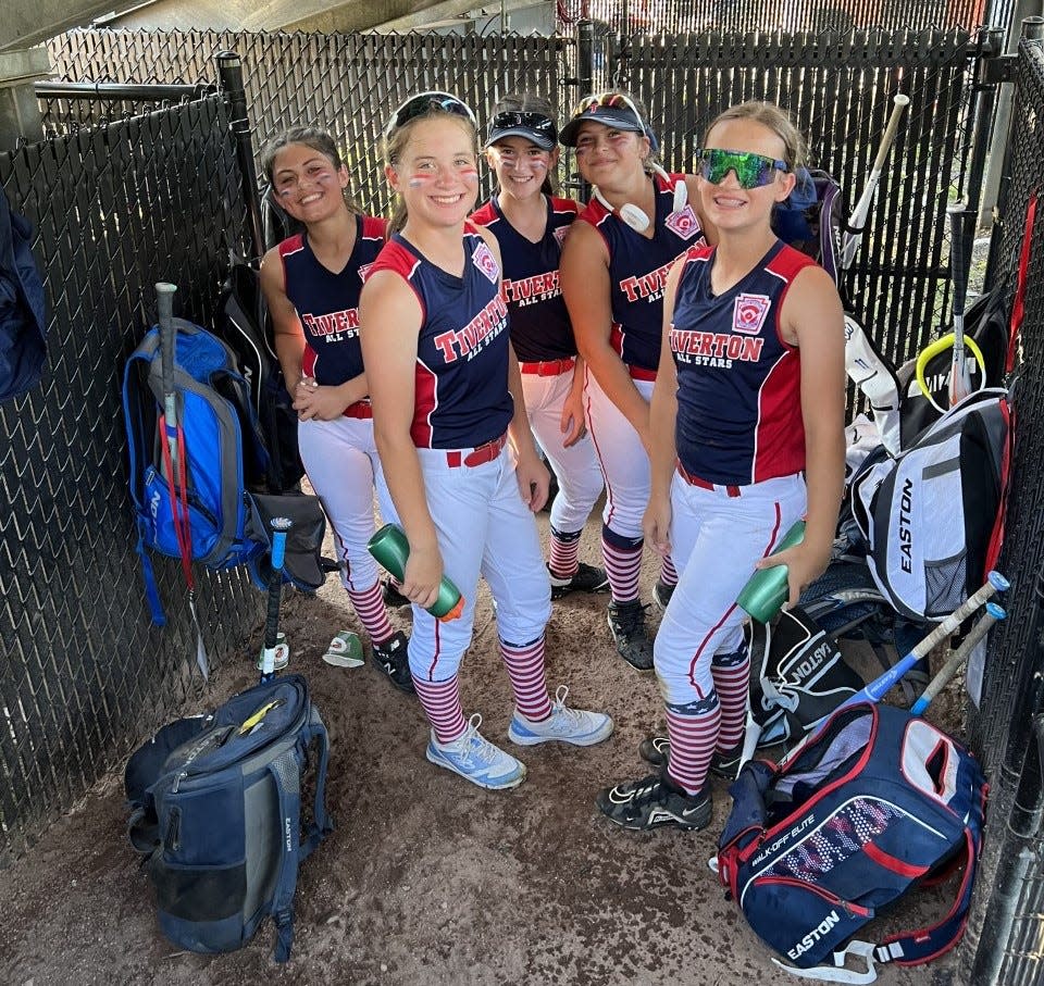 Tiverton all-star catcher Paisley Parisee, right, stands with her teammates.