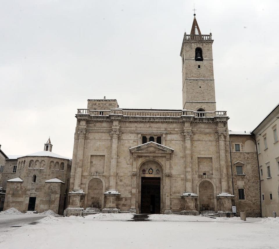 Snow covers Baptistery and Piazza dell'Arengo and Cathedral of St. Emidio in Ascoli Piceno, Italy.