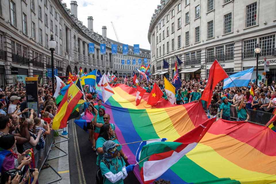 <p>A giant rainbow flag is carried down Regent Street during the Pride in London Festival on July 8, 2017 in London, England. (Photo: Jack Taylor/Getty Images) </p>