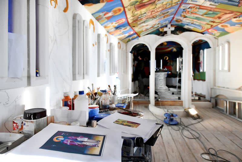 Georgian restorers work on frescoes at the chapel of a mobile Georgian Orthodox monastery in Vlissingen