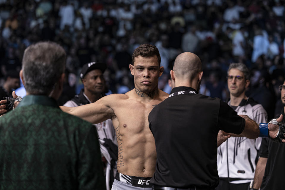 Oct 22, 2022; Abu Dhabi, UAE; Caio Borralho (blue gloves) before his fight against Makhmud Muradov during UFC 280 at Etihad Arena. Mandatory Credit: Craig Kidwell-USA TODAY Sports