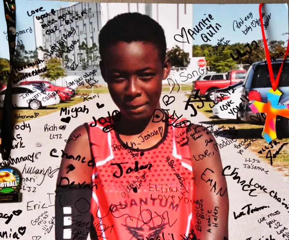 A poster of Jeremiah Khyree Brown that his mother, Chrisel Brown,  had friends and family sign on what would have been his 15th birthday, He was shot  and killed in The Compound on Christmas, 2022. 