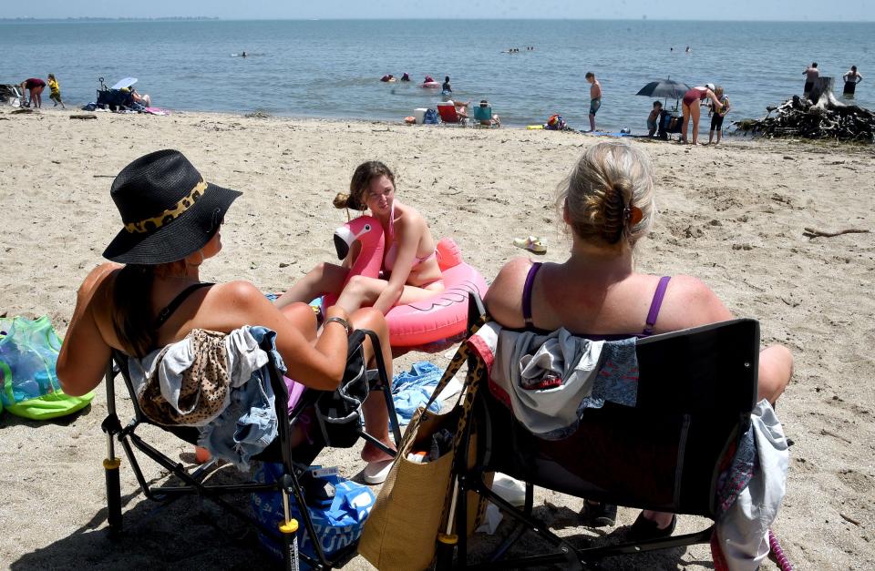 A group enjoys the beach at Sterling State Park in Frenchtown Township. Monroe News file photo