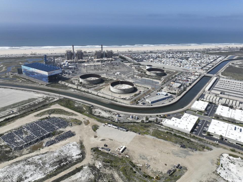 An aerial view of a beachside industrial area