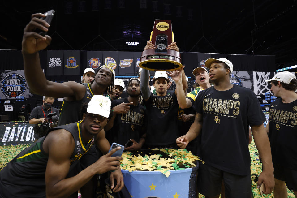 Baylor's MaCio Teague holds up the trophy after defeating the Gonzaga Bulldogs in the national championship game of the 2021 NCAA tournament on April 05. (Jamie Squire/Getty Images)