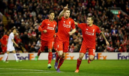 Football Soccer - Liverpool v FC Augsburg - UEFA Europa League Round of 32 Second Leg - Anfield, Liverpool, England - 25/2/16 James Milner celebrates with team mates after scoring the first goal for Liverpool Action Images via Reuters / Carl Recine Livepic EDITORIAL USE ONLY.