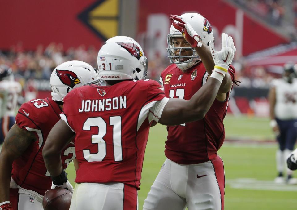 Arizona Cardinals running back David Johnson (31) celebrates his touchdown catch against the Chicago Bears with Larry Fitzgerald, right, and Christian Kirk (13) during the first half of an NFL football game, Sunday, Sept. 23, 2018, in Glendale, Ariz. (AP Photo/Rick Scuteri)