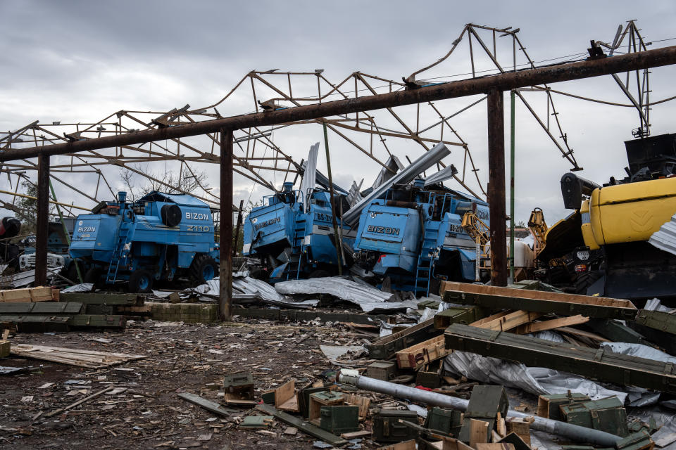 Farming machinery lies in ruins after being destroyed during fighting between Ukrainian and Russian forces