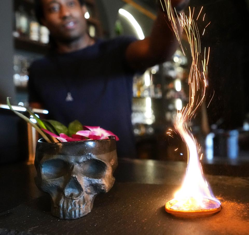 A "Pride" cocktail mixed with mezcal, hibiscus pecan orgeat with an assortment of fresh juices served in a handmade skull mug inside Picado, a speakeasy just through the back garden at Santo awaits patrons at the new Arcadia neighborhood restaurant in Phoenix on Feb. 21, 2024.